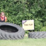 photo of participant lifting tire at the 2025 H-F Beast Obstacle Course Dash