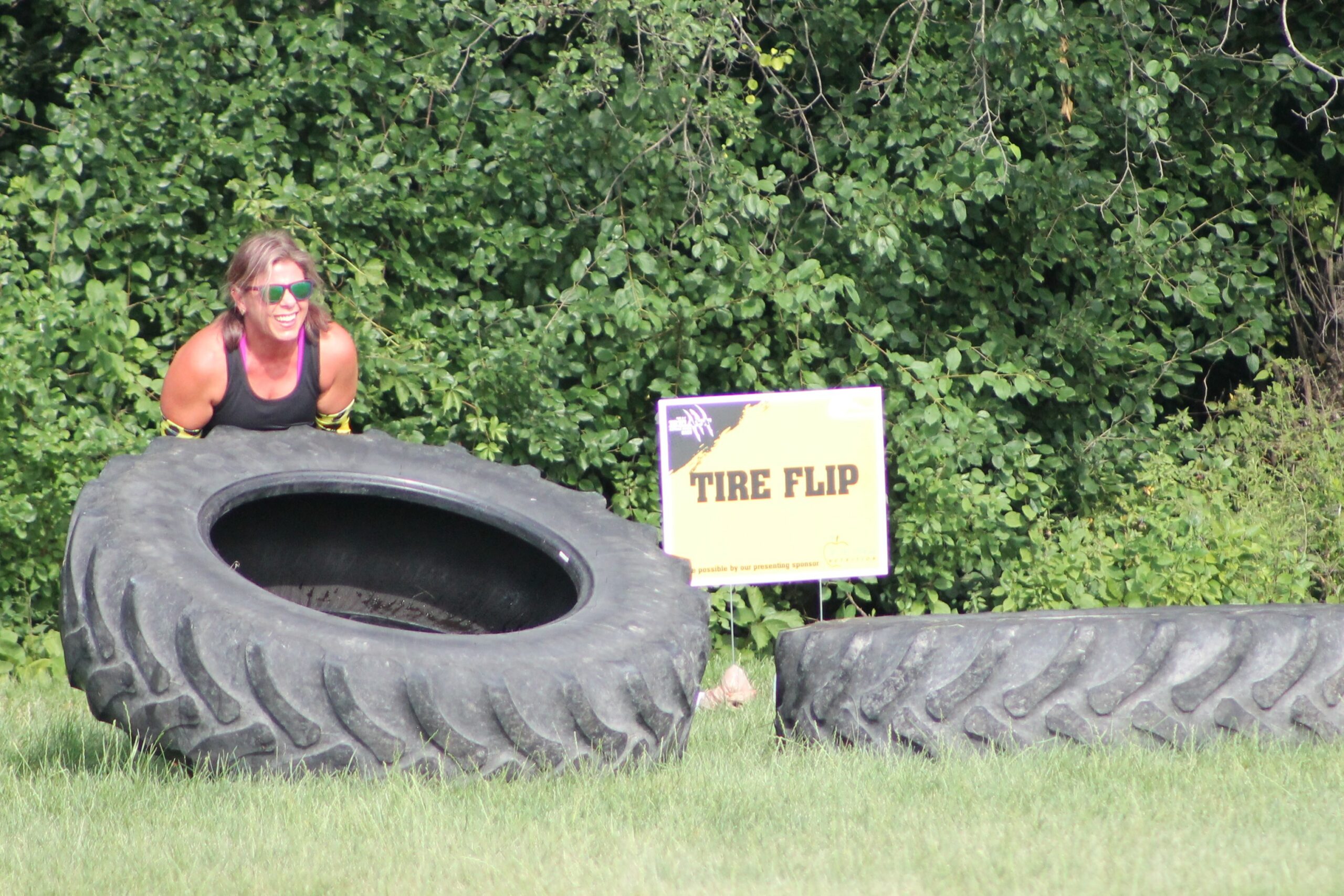 photo of participant lifting tire at the 2025 H-F Beast Obstacle Course Dash
